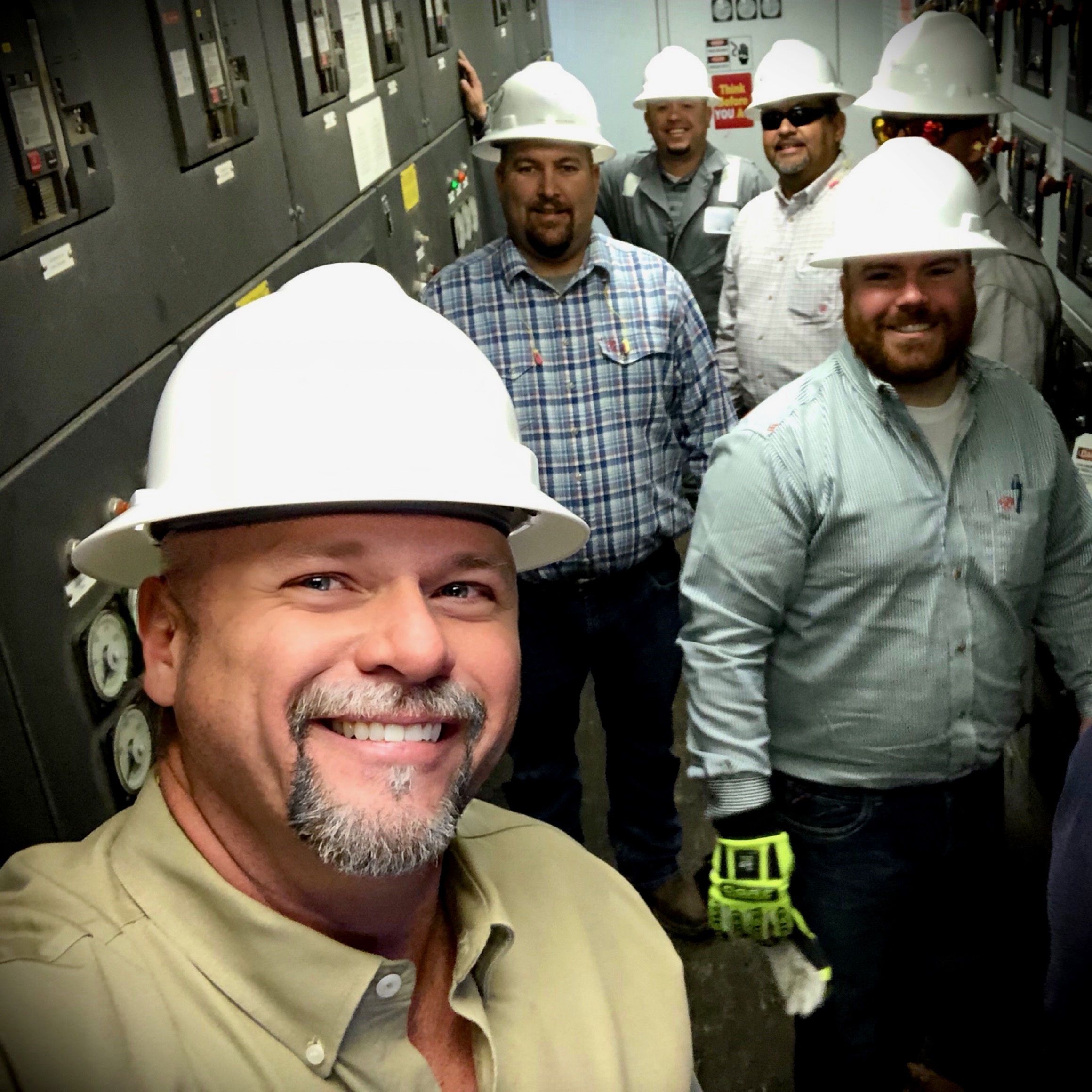 Trey Ramsey on a drilling rig with operations leaders